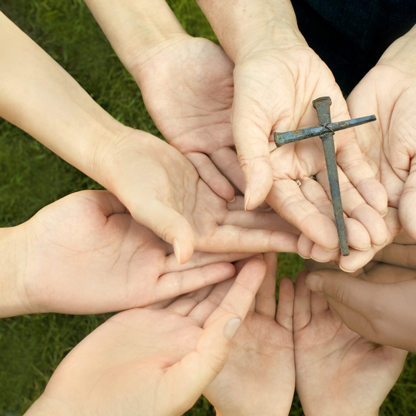 Handmade cross / nautilus_shell_studios 'Hands from people of all ages from children and teenagers to adults and the elderly, hands holding a handmade cross, made from old nails (shallow DOF with focus on the cross). Please see some similar pictures from my portfolio:'